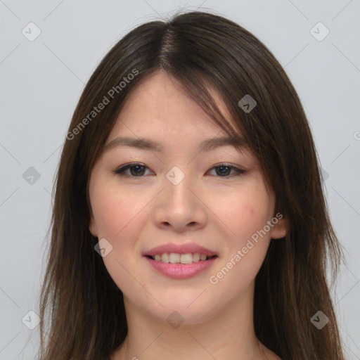 Joyful asian young-adult female with long  brown hair and brown eyes