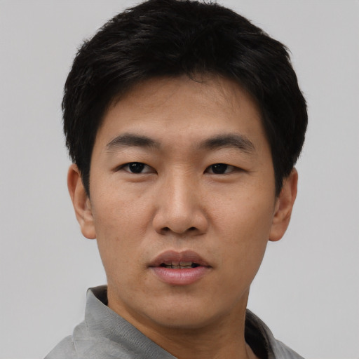 Neutral asian young-adult male with short  black hair and brown eyes