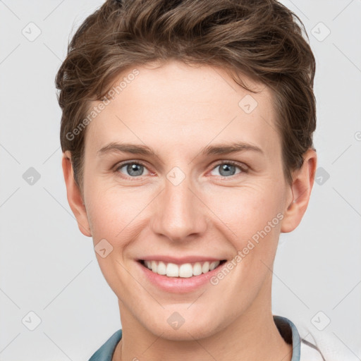 Joyful white young-adult female with short  brown hair and grey eyes