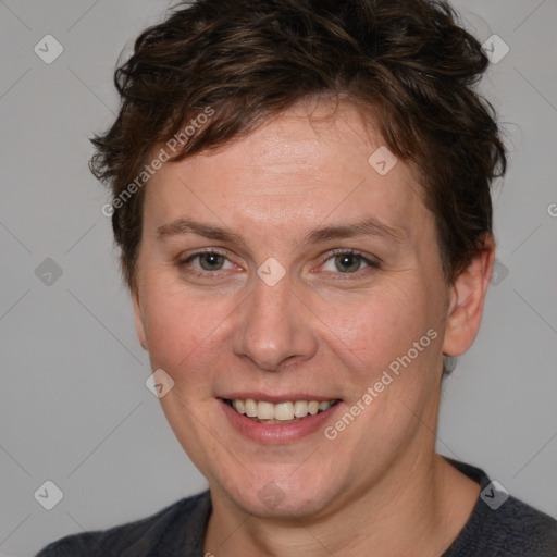 Joyful white adult female with short  brown hair and brown eyes