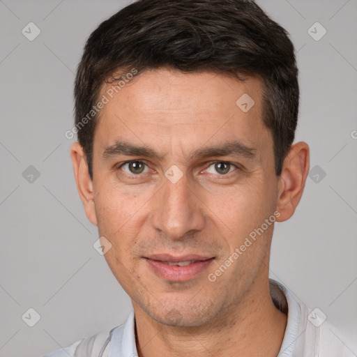 Joyful white adult male with short  brown hair and brown eyes