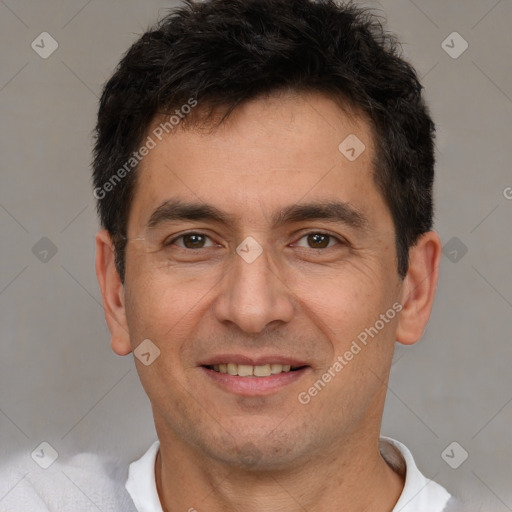 Joyful white adult male with short  brown hair and brown eyes