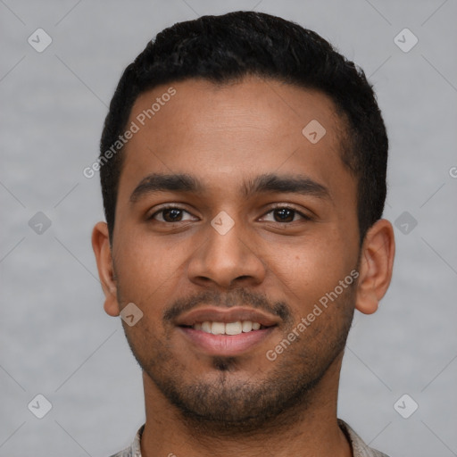 Joyful latino young-adult male with short  brown hair and brown eyes