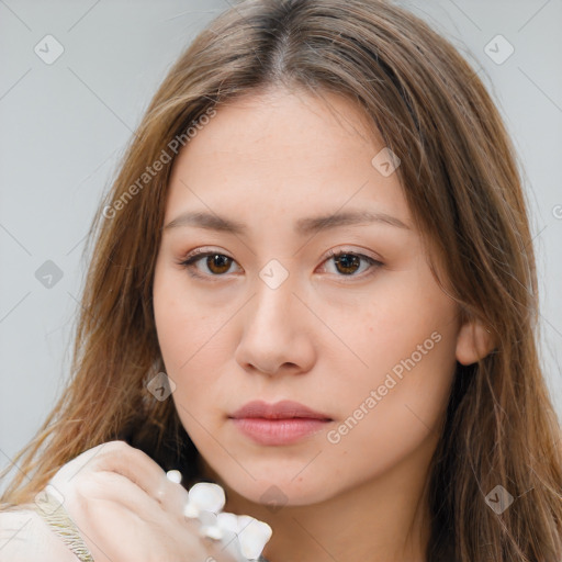 Neutral white young-adult female with long  brown hair and brown eyes