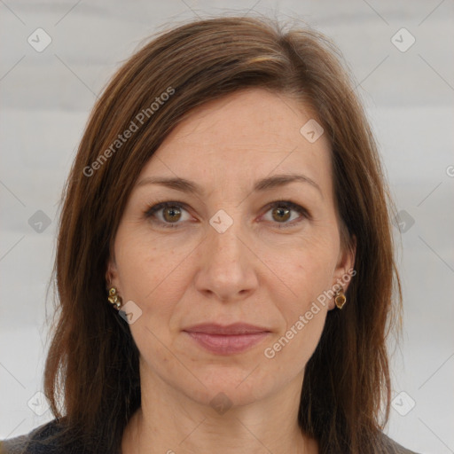 Joyful white adult female with long  brown hair and brown eyes