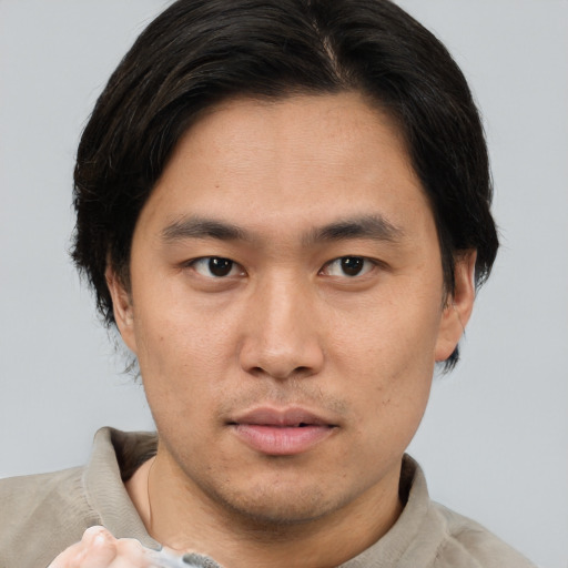 Neutral asian young-adult male with short  brown hair and brown eyes