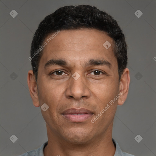 Joyful white adult male with short  black hair and brown eyes