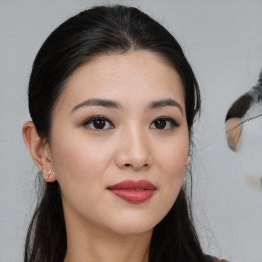 Joyful white young-adult female with medium  black hair and brown eyes