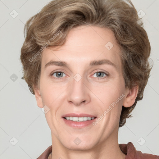 Joyful white adult female with short  brown hair and grey eyes