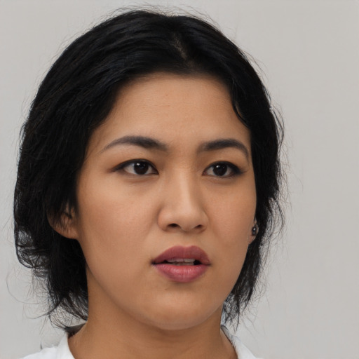 Neutral asian young-adult female with medium  black hair and brown eyes