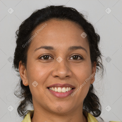 Joyful latino adult female with medium  brown hair and brown eyes