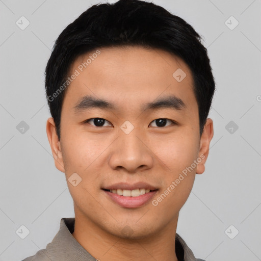 Joyful asian young-adult male with short  black hair and brown eyes