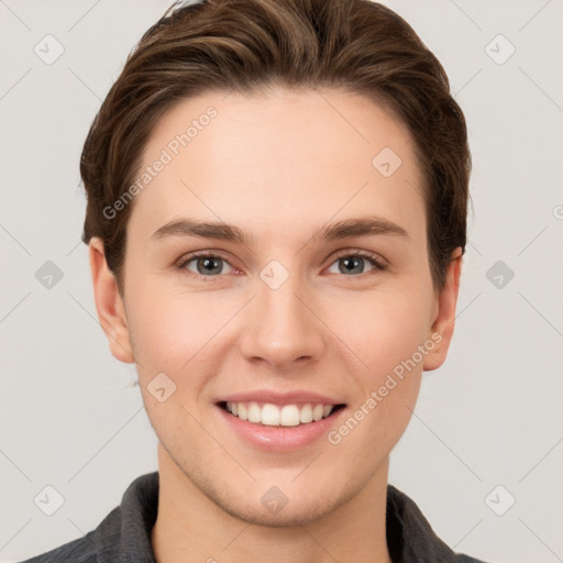 Joyful white young-adult female with short  brown hair and grey eyes