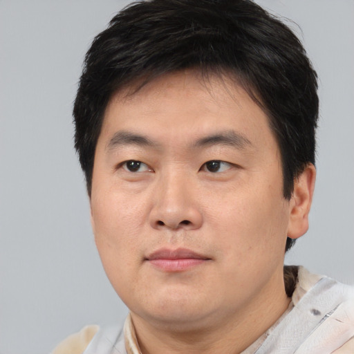 Neutral asian young-adult male with short  brown hair and brown eyes