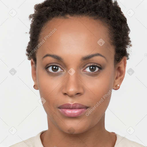 Joyful black young-adult female with short  brown hair and brown eyes