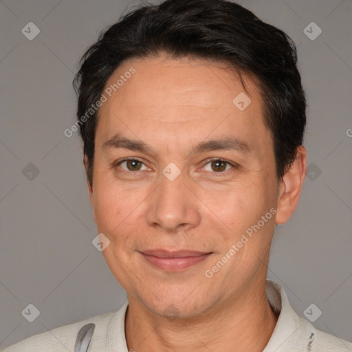 Joyful white adult male with short  black hair and brown eyes