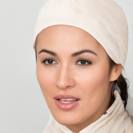 Joyful white young-adult female with medium  black hair and brown eyes