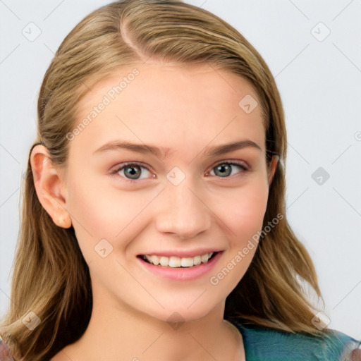 Joyful white young-adult female with long  brown hair and blue eyes