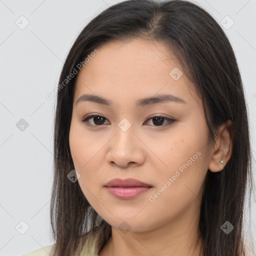 Joyful asian young-adult female with long  brown hair and brown eyes