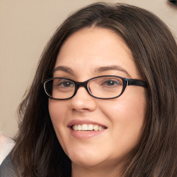 Joyful white young-adult female with long  brown hair and blue eyes