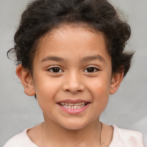 Joyful white child male with short  brown hair and brown eyes