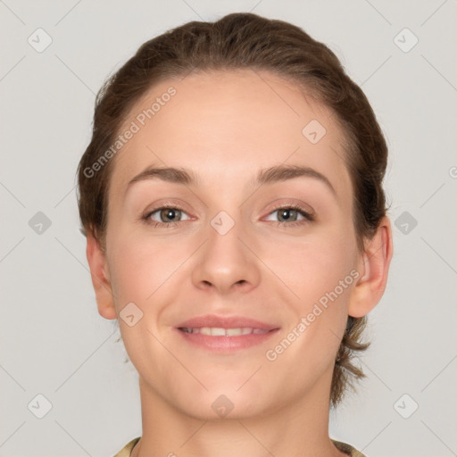 Joyful white young-adult female with short  brown hair and grey eyes