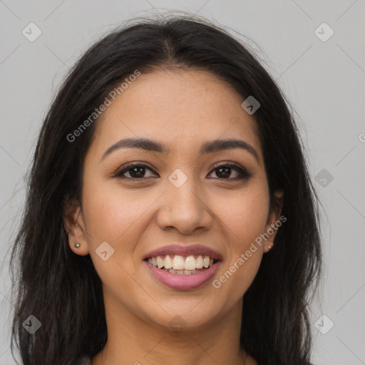 Joyful latino young-adult female with long  brown hair and brown eyes