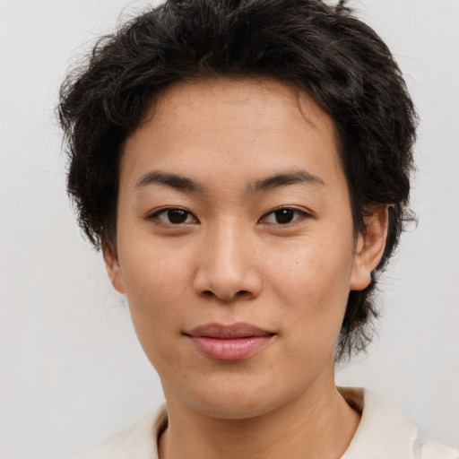 Joyful asian young-adult female with short  brown hair and brown eyes