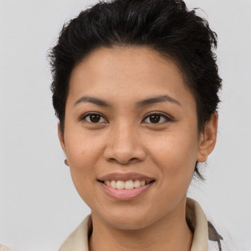 Joyful asian young-adult female with short  brown hair and brown eyes