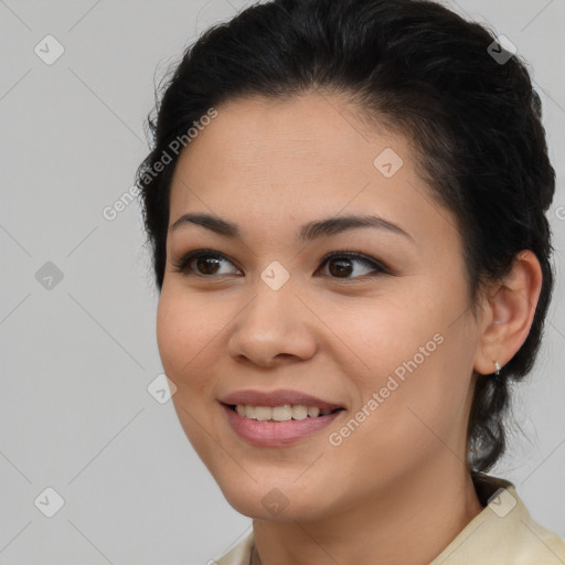 Joyful latino young-adult female with medium  brown hair and brown eyes