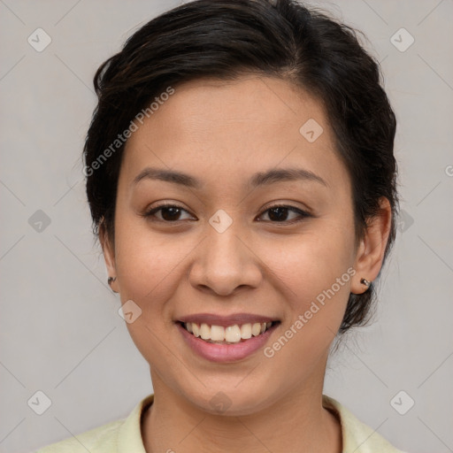 Joyful asian young-adult female with medium  brown hair and brown eyes