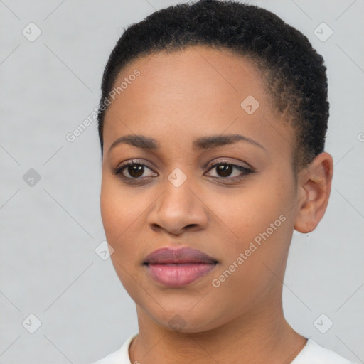 Joyful black young-adult female with short  black hair and brown eyes