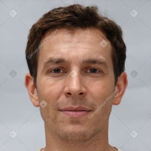 Joyful white adult male with short  brown hair and brown eyes