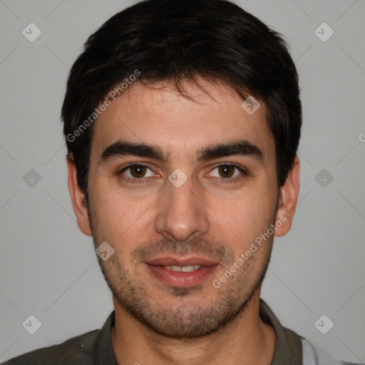 Joyful white young-adult male with short  black hair and brown eyes