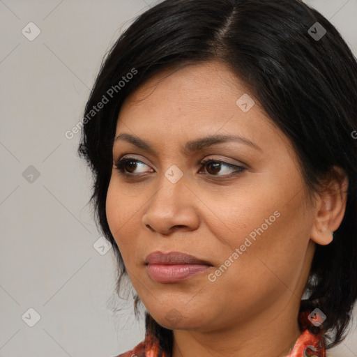 Joyful latino young-adult female with medium  brown hair and brown eyes