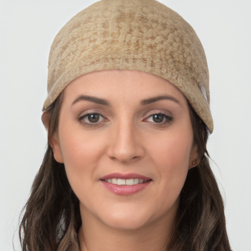 Joyful white young-adult female with long  brown hair and grey eyes