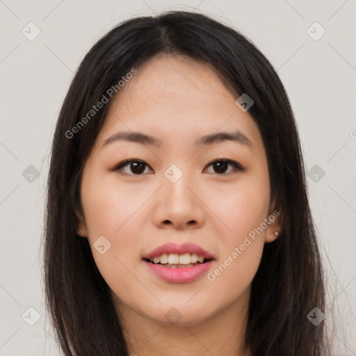 Joyful asian young-adult female with long  brown hair and brown eyes