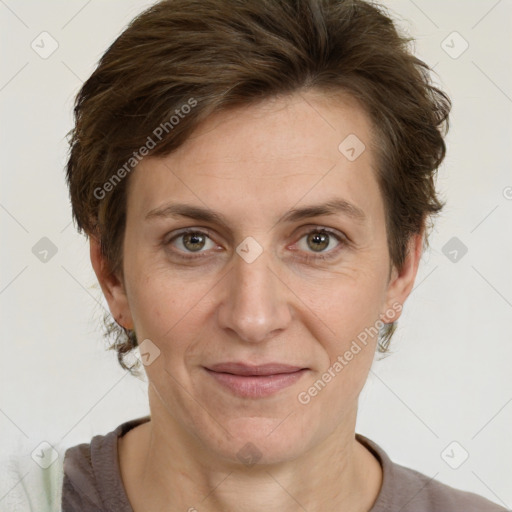 Joyful white adult female with short  brown hair and grey eyes