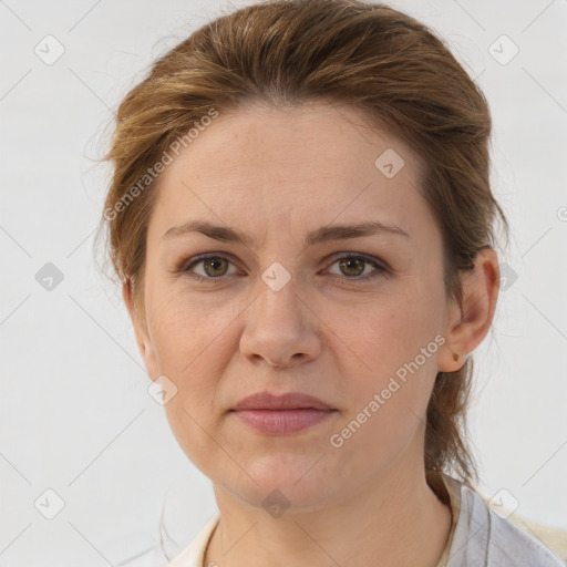 Joyful white adult female with medium  brown hair and grey eyes