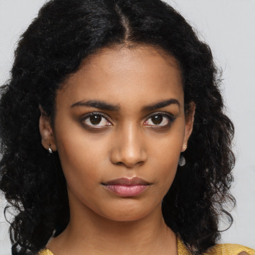 Neutral black young-adult female with medium  black hair and brown eyes