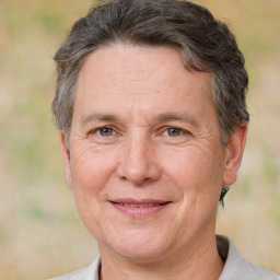 Joyful white middle-aged male with short  brown hair and brown eyes