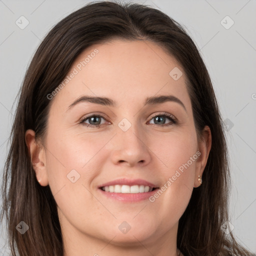 Joyful white young-adult female with long  brown hair and grey eyes