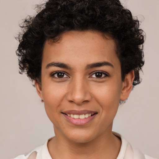 Joyful latino young-adult female with short  brown hair and brown eyes