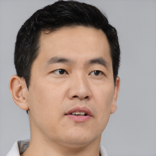 Neutral asian young-adult male with short  black hair and brown eyes