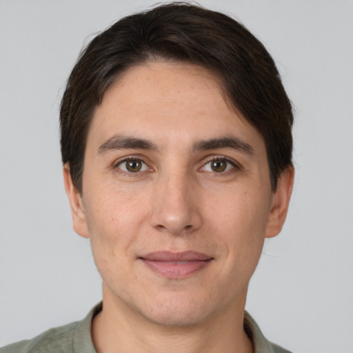 Joyful white adult male with short  brown hair and brown eyes