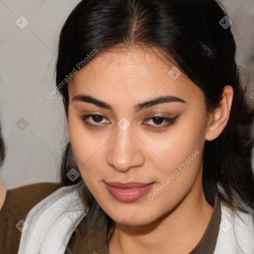 Joyful latino young-adult female with medium  brown hair and brown eyes