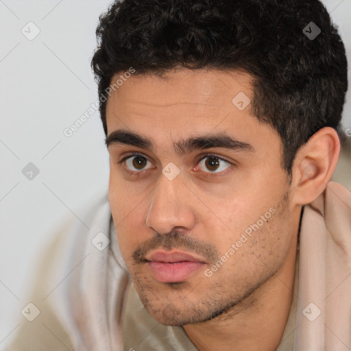 Neutral white young-adult male with short  black hair and brown eyes