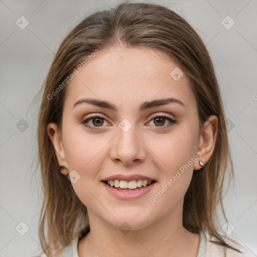 Joyful white young-adult female with medium  brown hair and grey eyes