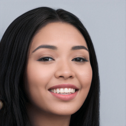 Joyful white young-adult female with long  black hair and brown eyes