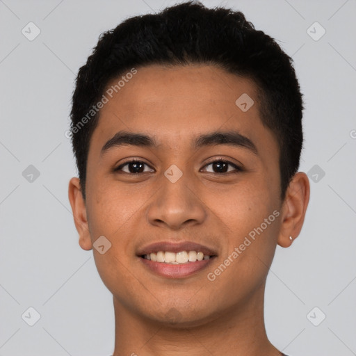 Joyful latino young-adult male with short  black hair and brown eyes